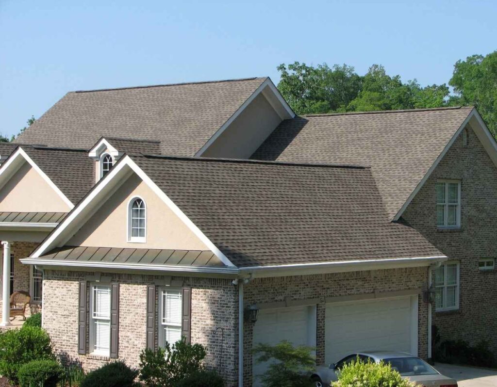 Commercial roofing Norfolk VA finished shingle roof installation on brick home.