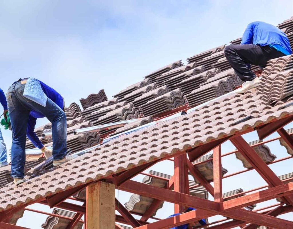 Virginia Beach VA roofer installing red tile roof.