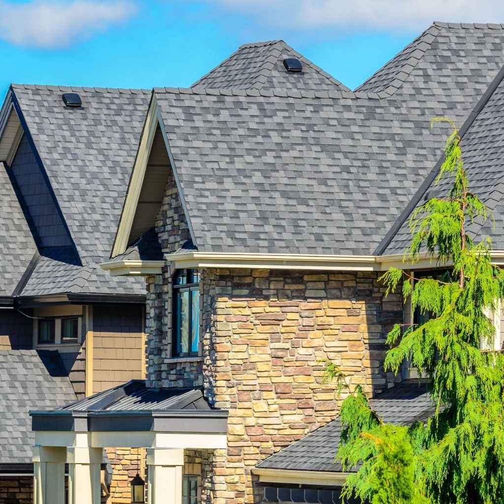 Commercial roofing Norfolk VA finished shingle roof installation on brick home.